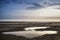 Conceptual landscape image of two people on remote beach