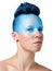 Conceptual makeup, blue mask. Portrait of a young woman with a sensual look