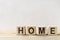 Conceptual message from letters on wooden cubes, word home