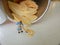 Conceptual, Photo 1 woman cleaning spill of cheese potato chips