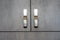 Conceptual photo of the doors of a modern gray wardrobe with chrome handles