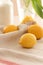 Conceptual photo in Kitchen. Yellow lemons, sugar and yellow tulips on the table. Conceptual photo. Interior Photos