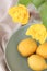 Conceptual photo in Kitchen. Yellow lemons, yellow tulips on the table. Conceptual photo. Interior Photos