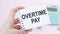 Conceptual photo about OVERTIME PAY with written text. Overtime is the amount of time someone works beyond normal