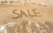 Conceptual photo of Sale written on sandy beach