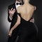 Conceptual photo of sexy elegant couple in the evening suit and dress