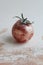 Conceptual photo of a tomato wearing make up. Every tomato deserves some make up