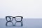 Conceptual photograph of life, spectacles with matte black frame