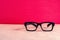 Conceptual photograph of life, spectacles with matte black frame