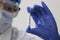 A conceptual photograph is testing for coronavirus: in the hand is a test tube