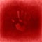 Conceptual red painted hand imprint