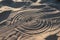 Conceptual sundial on the beach sand