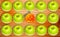 Conceptual view of allergic and hypoallergic fruits; green apples and smilling orange tangerine