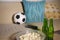 Conceptual watching football game at sofa on television with beer bottles and popcorn bowl in friends enjoying soccer game TV