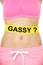 Conceptual Woman Stomach with Gassy Text on Tape