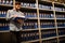 Concerned businessman reading file in storage room