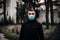 Concerned man wearing a protective mask.Activities in time of epidemic/pandemic.Panic and fear of infection.Contaminated area