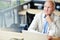 Concerned Mature Businessman in Cafe