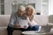 Concerned older couple read received formal notification from bank