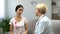 Concerned woman consulting with mammologist, tumor in breast, cancer prevention