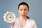 Concerned woman pointing on clock time management