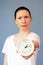 Concerned woman Time Management pointing on clock