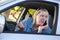 Concerned Woman Using Cell Phone While Driving