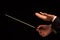 Concert conductor hands with baton