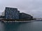 Concert hall and conference center Harpa in Reykjavik downtown with colorful glass facade inspired by basalt formations.