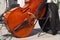 Before the concert the orchestra gathers, the double bass is on a chair and the musician`s jacket hangs on the back of the chair