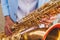 Concert view of saxophonist in a blue and white suit, a saxophone sax player with vocalist and musical band during jazz orchestra