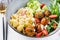 Conchiglie with meatballs, feta cheese and salad on light background.