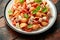 Conchiglie Tuna pasta with tomato sauce, feta cheese and basil on wooden table.