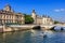 Conciergerie Castle and Seine River with cruise tour boat. Paris, France