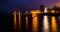 Concord Point Lighthouse and a pier at night in Havre de Grace