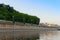 Concrete bank of reservoir with lanterns and forest