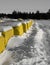 Concrete barrier under Canadian winter snow in Quebec