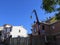 Concrete being lifted onto building site roof