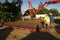 Concrete being pumped to make foundations for a new shed.