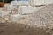 Concrete bins holding rocks and construction material