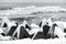 Concrete breakwaters covered with snow, winter sea backdrop