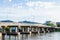 The concrete bridge across the Khwae river with blue sky, Kanchanaburi province, Thailand