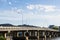 The concrete bridge across the Khwae river with blue sky, Kanchanaburi province, Thailand