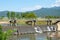 Concrete bridge over the weir in the river. Which flows from the