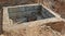 Concrete bunker for sewage valves built in a sand pit