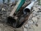 Concrete drainage pipes under road and excavator