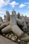 Concrete fortifications in the seaport. Tetrapods stacked on the edge of a breakwater in Central Europe