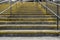 Concrete grey and yellow steps. Urban dirty grubby background or concept.