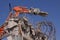 Concrete industrial building demolition - building destruction with machinery - blue sky - stock