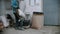 Concrete industry - man worker puts dry cement in a bucket